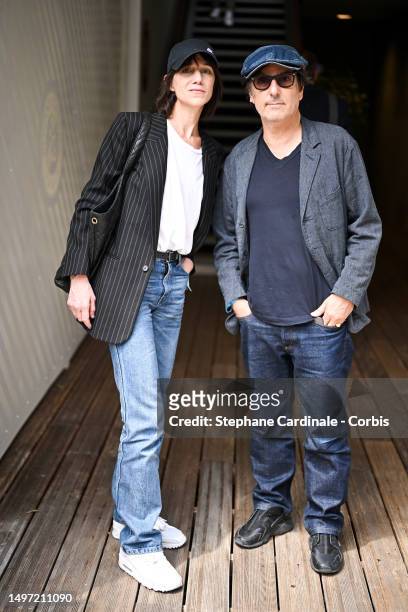 Charlotte Gainsbourg and Yvan Attal attend the 2023 French Open at Roland Garros on June 09, 2023 in Paris, France.