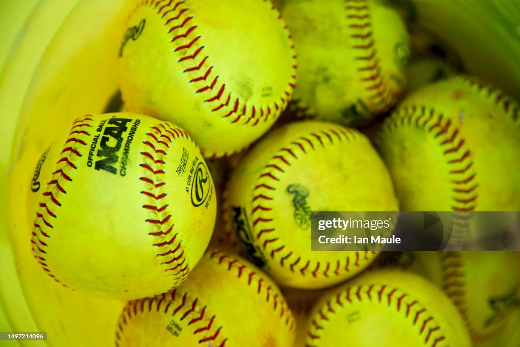 NCAA Official Softballs Sit In A Bucket During Game Two Of The NCAA ncaa-official-softballs-sit-in-a-bucket-during-game-two-of-the-ncaa