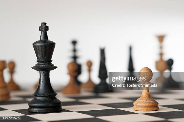 one-on-one battle between pawn and  king - pawn chess piece stock pictures, royalty-free photos & images