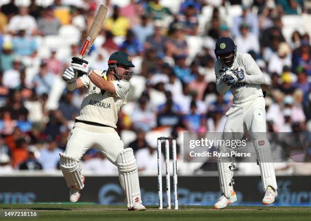 Travis Head of Australia bats as KS Bharat of India keeps wicket during day three of the ICC World Test Championship Final between Australia and...