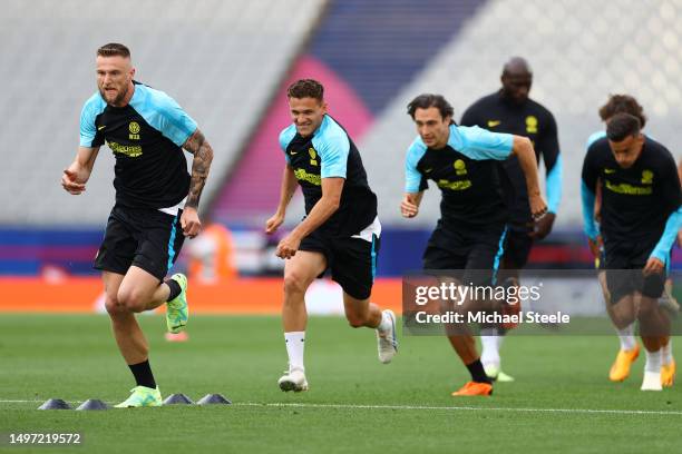 Milan Skriniar of FC Internazionale warms up with teammates during the FC Internazionale Training Session ahead of UEFA Champions League 2022/23...