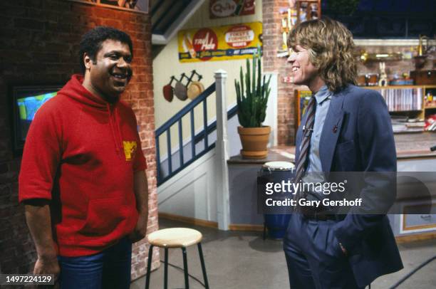 American VJ JJ Jackson and British Rock & Pop musician Peter Noone share a smile before an MTV interview at Teletronic Studios, New York, New York,...