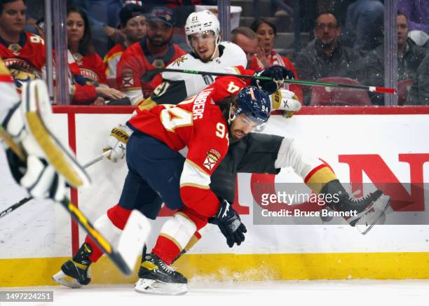 Brett Howden of the Vegas Golden Knights is checked by Ryan Lomberg of the Florida Panthers in Game Three of the 2023 NHL Stanley Cup Final at FLA...