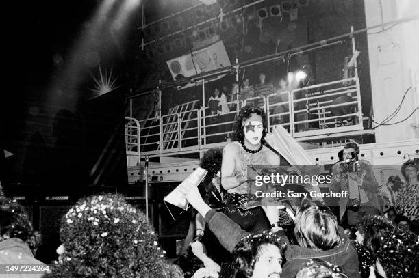 American Rock musician Paul Stanley , of the group Kiss, signs autographs as he stands onstage at Studio 54, New York, New York, January 28, 1982....