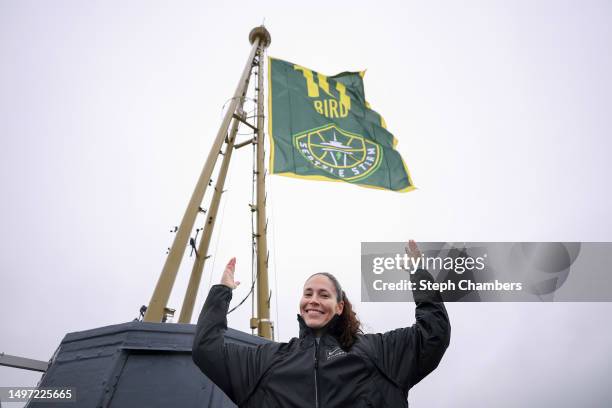 Sue Bird poses next to her flag, ahead of her Seattle Storm jersey retirement celebration, at The Space Needle on June 09, 2023 in Seattle,...