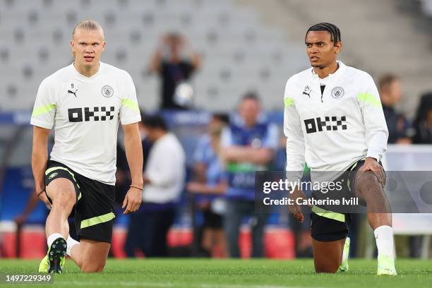 Erling Haaland and Manuel Akanji of Manchester City stretch during the Manchester City Training Session ahead of the UEFA Champions League 2022/23...