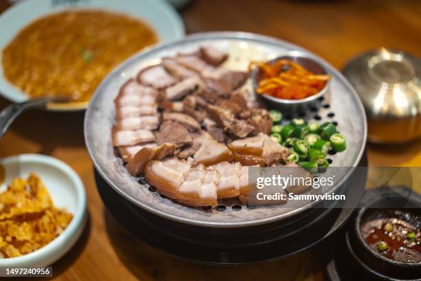 close-up of various of korean food on the table - schweinebauch stock-fotos und bilder