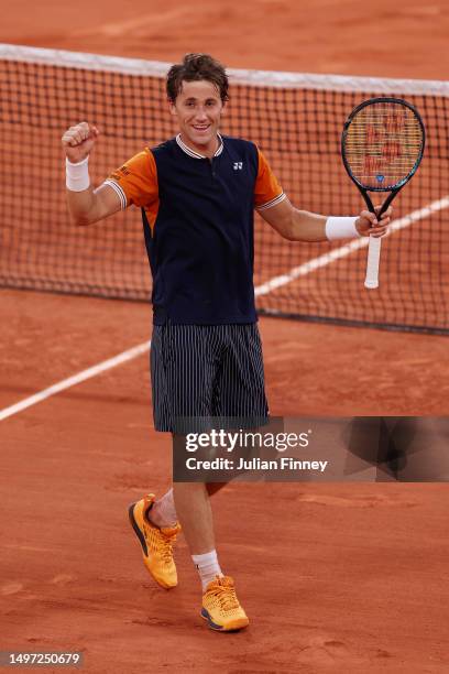 Casper Ruud of Norway celebrates winning match point against Alexander Zverev of Germany during the Men's Singles Semi Final match on Day Thirteen of...