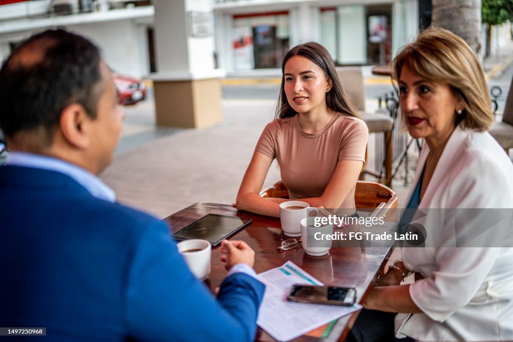 Business colleagues having a meeting at a coffee shop