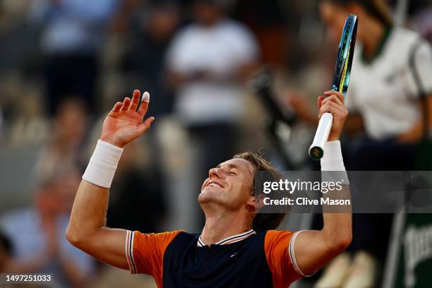 Casper Ruud of Norway celebrates winning match point against Alexander Zverev of Germany during the Men's Singles Semi Final match on Day Thirteen of...