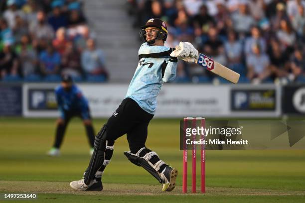 Tom Curran of Surrey hits a six during the Vitality Blast T20 match between Sussex Sharks v Surrey CCC at The 1st Central County Ground on June 09,...