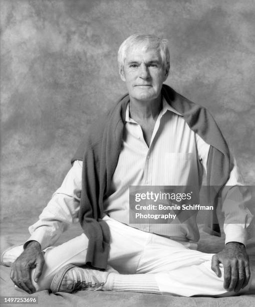 American psychologist Timothy Leary poses for a portrait sitting with a sweater over his shoulders in Los Angeles, California, circa 1983.