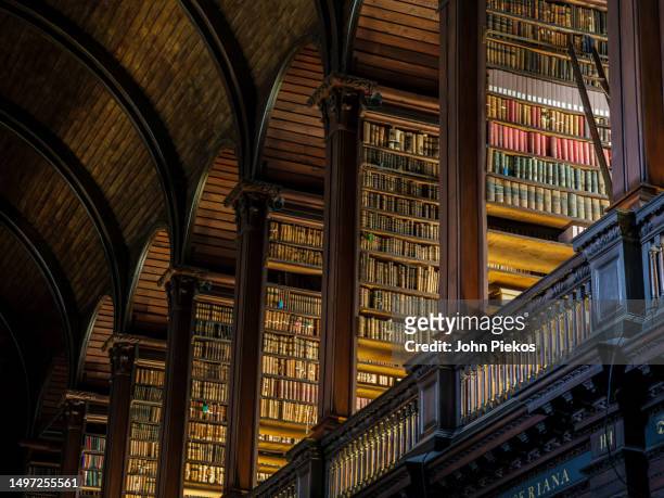 the long room library at trinity college in dublin, ireland - trinity college library imagens e fotografias de stock
