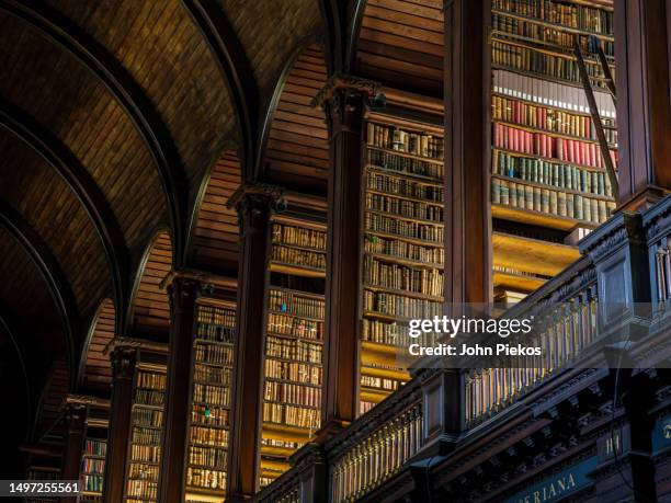the long room library at trinity college in dublin, ireland - lybrary imagens e fotografias de stock