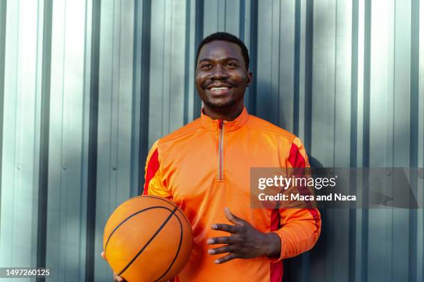Portrait Of African American Man With Basketball Ball High-Res Stock Photo