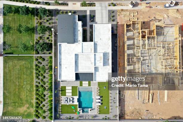 An aerial view of new home construction at a housing development in the Phoenix suburbs on June 9, 2023 in Queen Creek, Arizona. Queen Creek is one...
