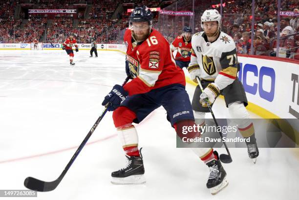 Aleksander Barkov of the Florida Panthers controls the puck in the corner in front of William Karlsson of the Vegas Golden Knights during the second...