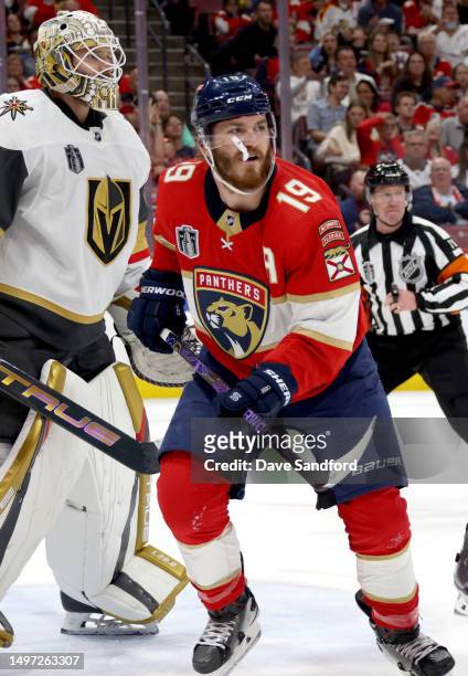 Matthew Tkachuk of the Florida Panthers hangs around the net and goaltender Adin Hill of the Vegas Golden Knights during the second period of Game...