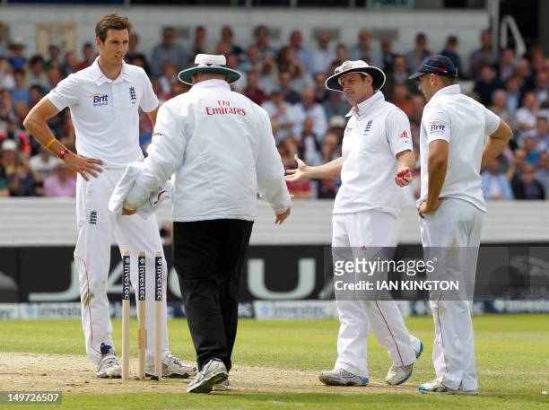 England's Captain Andrew Strauss gestures to Umpire Steve Davis after he calls a dead ball as England appeal for the wicket of South African Captain...