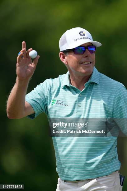 Justin Leonard of United States reacts after making a putt on the 18th green during the first round of the American Family Insurance Championship at...