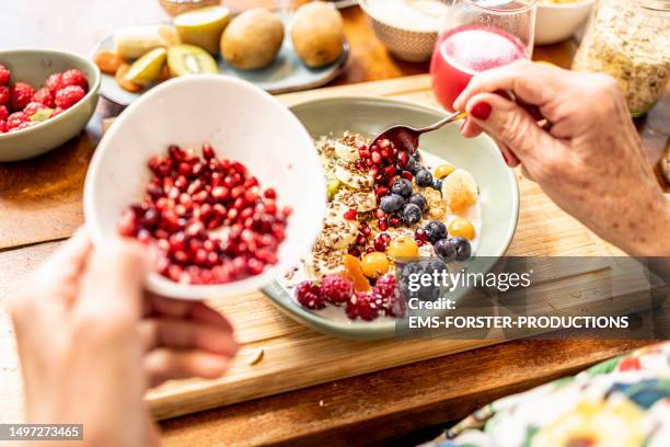 close up of healthy fruit bowl - superfood with yogurt and fruits - ems fitness stock-fotos und bilder