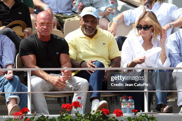 Dida Diafat, Mike Tyson, Ana Girardot attend day 13 of the 2023 French Open at Stade Roland Garros on June 9, 2023 in Paris, France.