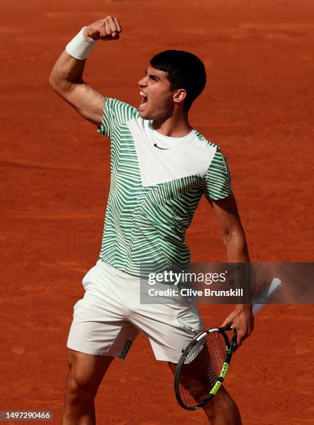 Carlos Alcaraz of Spain celebrates a point against Novak Djokovic of Serbia during the Men's Singles Semi Final match on Day Thirteen of the 2023...