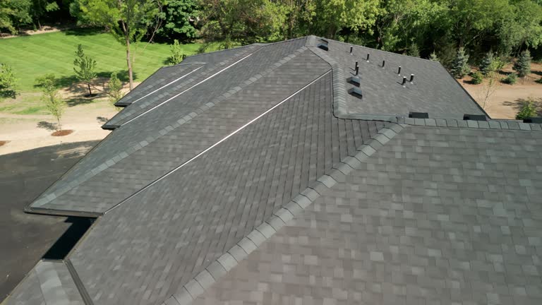 https://media.gettyimages.com/id/1497293113/video/wide-aerial-drone-shot-footage-of-new-roof-at-sunny-day.jpg?b=1&s=640x640&k=20&c=xHXB7Oq5wX-NNN-I-F56cserSAS5vi8EYNfsZ9Qg9ks=
