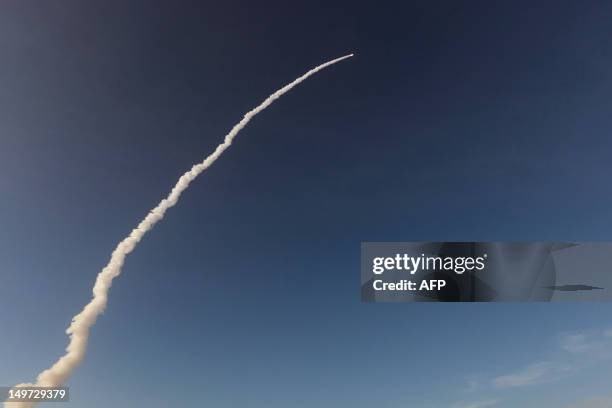 An Ariane-5 rocket, carrying two telecommunication satellites blasts off from the European space centre of Kourou, French Guiana on August 2, 2012....