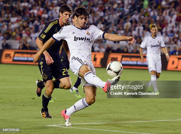 Alvaro Morata of Real Madrid shoots the ball in front of Andrew Boyens of Los Angeles Galaxy during the World Football Challenge at The Home Depot...