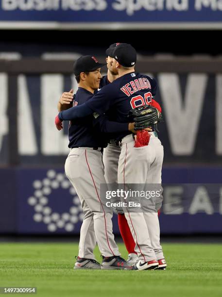 Masataka Yoshida,Adam Duvall and Alex Verdugo of the Boston Red Sox celebrate the win over the New York Yankees at Yankee Stadium on June 9, 2023 in...