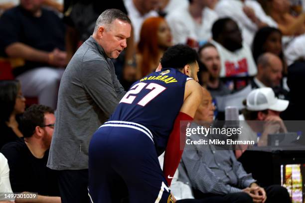 Head coach Michael Malone of the Denver Nuggets talks with Jamal Murray during the second quarter against the Miami Heat in Game Four of the 2023 NBA...