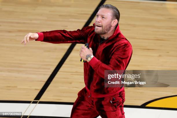 Conor McGregor is seen on the court during a timeout in Game Four of the 2023 NBA Finals between the Denver Nuggets and the Miami Heat at Kaseya...