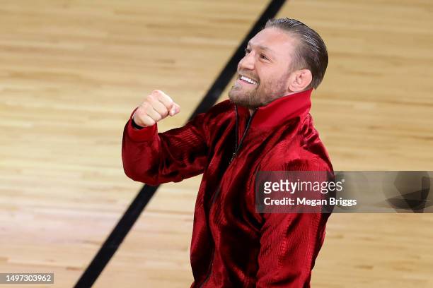 Conor McGregor is seen on the court during a timeout in Game Four of the 2023 NBA Finals between the Denver Nuggets and the Miami Heat at Kaseya...