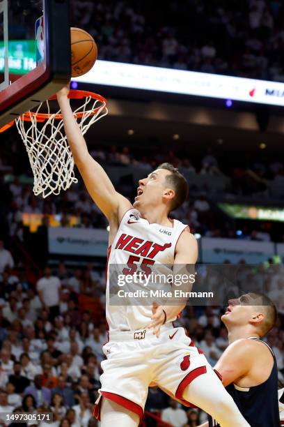 Duncan Robinson of the Miami Heat drives to the basket during the third quarter against the Denver Nuggets in Game Four of the 2023 NBA Finals at...