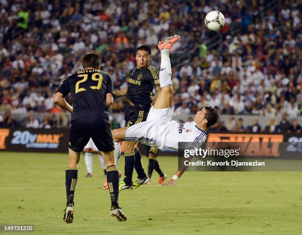 Cristiano Ronaldo of Real Madrid attempts a bicycle kick against Rafael Garcia and Andrew Boyens of Los Angeles Galaxy during the World Football...