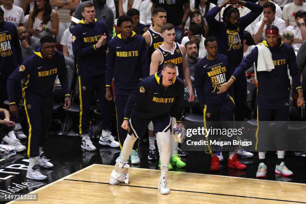 Nikola Jokic of the Denver Nuggets reacts on the bench during the fourth quarter against the Miami Heat in Game Four of the 2023 NBA Finals at Kaseya...