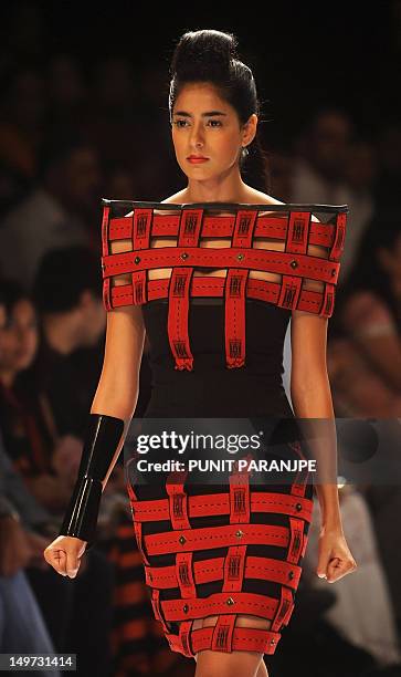 Model showcases a creation during the Next Generation fashion show on the first day of Lakme Fashion Week winter/festive 2012 in Mumbai on August 3,...