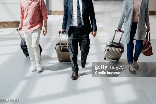 business people walking with luggages - filipino people stock pictures, royalty-free photos & images