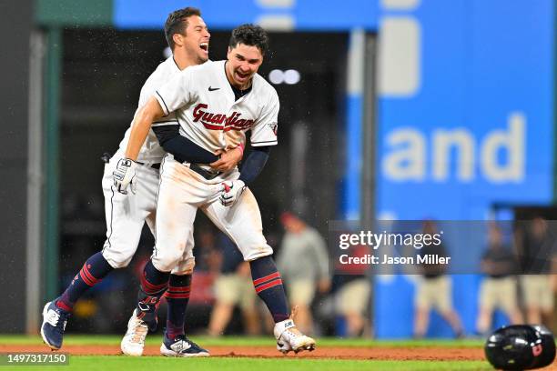 Tyler Freeman celebrates with Will Brennan of the Cleveland Guardians after Brennan hit a walk-off RBI double during the fourteenth inning to defeat...