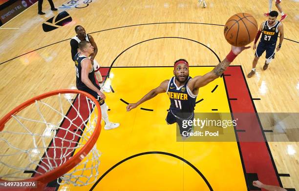 Bruce Brown of the Denver Nuggets rebounds the ball during the second half against the Miami Heat in Game Four of the 2023 NBA Finals at Kaseya...