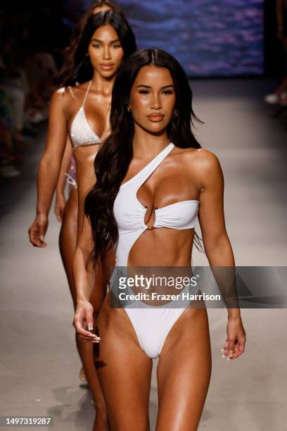 Models walk the runway for the Neena Swim Fashion Show presented by Oh Polly during Paraiso Miami Swim Week at The Paraiso Tent on June 09, 2023 in...