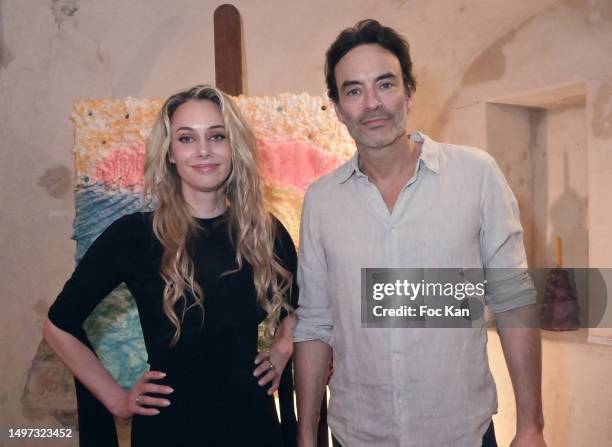 Painter Johanna Capliez and Anthony Delon attend "Hot Candles" Johanna Capliez’s preview at Atelier de Visconti on June 09, 2023 in Paris, France.