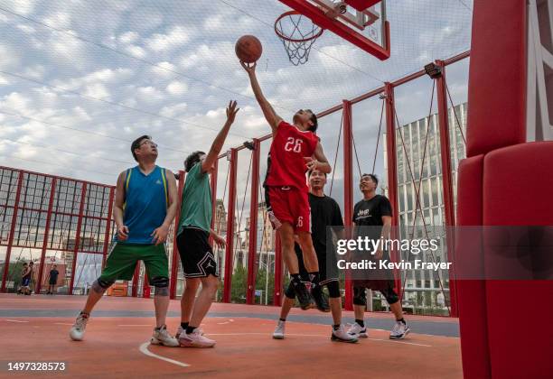 Players take part in a pick up game of basketball at the newly opened NBA Hoop Park on June 8, 2023 in Beijing, China. The sport has grown in...