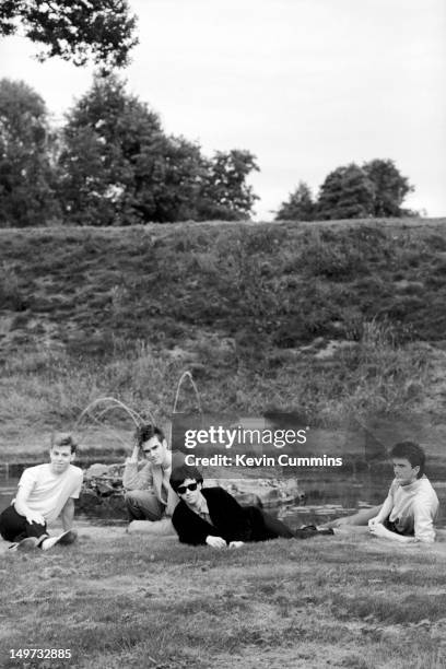 English alternative rock band, The Smiths, Dunham Massey, Greater Manchester, 7th September 1983. Left to right: bassist Andy Rourke, singer...