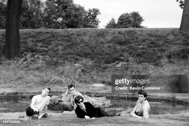 English alternative rock band, The Smiths, Dunham Massey, Greater Manchester, 7th September 1983. Left to right: bassist Andy Rourke, singer...