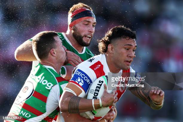 Jaydn Su'a of the Dragons is tackled during the round 15 NRL match between St George Illawarra Dragons and South Sydney Rabbitohs at Netstrata...