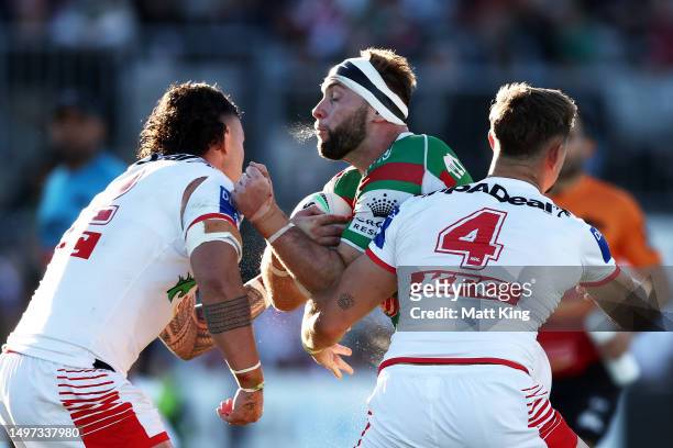 Jacob Host of the Rabbitohs is tackled during the round 15 NRL match between St George Illawarra Dragons and South Sydney Rabbitohs at Netstrata...