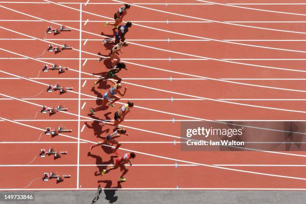 Jessica Ennis of Great Britain in lane 8 competes in the Women's Heptathlon 100m Hurdles Heat 1 on Day 7 of the London 2012 Olympic Games at Olympic...