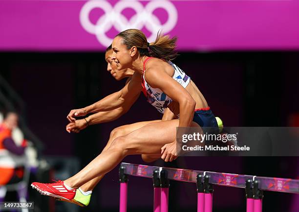 Jessica Ennis of Great Britain competes in the Women's Heptathlon 100m Hurdles Heat 1 on Day 7 of the London 2012 Olympic Games at Olympic Stadium on...